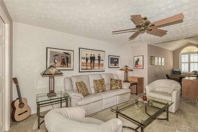 living room with lofted ceiling, ceiling fan, light carpet, and a textured ceiling