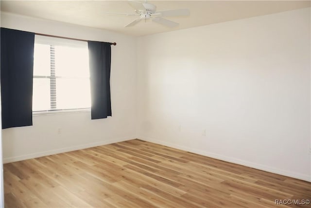 unfurnished room featuring light wood-type flooring and ceiling fan