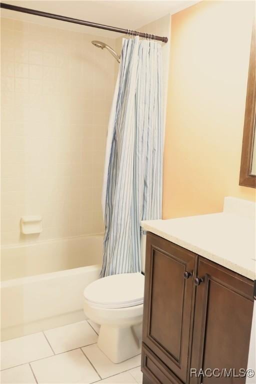 full bathroom with tile patterned floors, vanity, toilet, and shower / tub combo with curtain