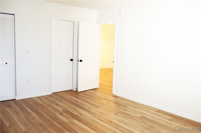 unfurnished bedroom featuring light wood-type flooring