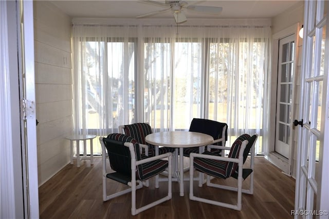 sunroom with ceiling fan, a healthy amount of sunlight, and french doors