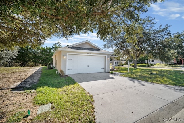 view of side of property with a yard and central AC