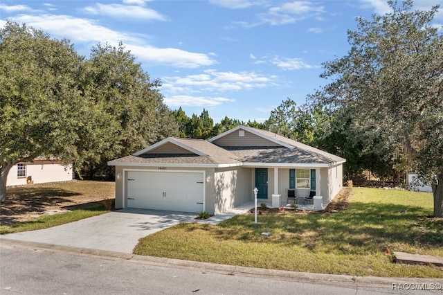 ranch-style home featuring a garage and a front lawn