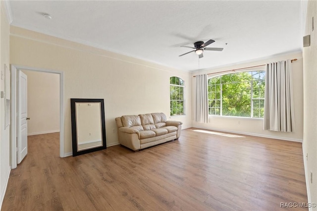 17108 Carrington Park Dr Unit 711, Tampa, FL 33647 - sitting room with ceiling fan, baseboards, and wood finished floors