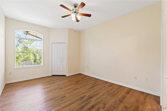 17108 Carrington Park Dr Unit 711, Tampa, FL 33647 - spare room with wood finished floors, ceiling fan, and baseboards