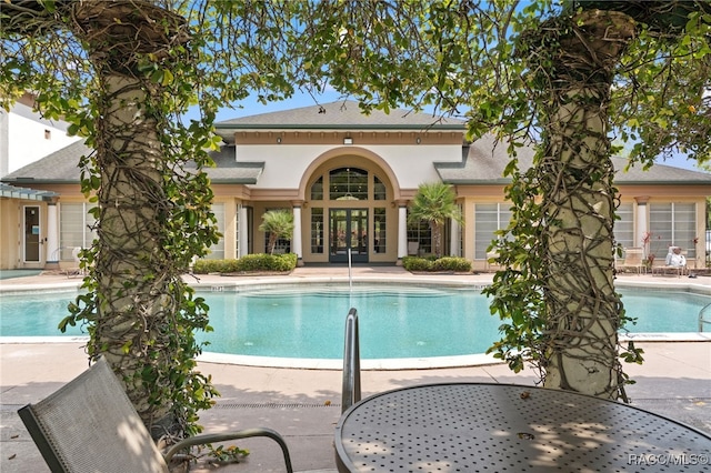 17108 Carrington Park Dr Unit 711, Tampa, FL 33647 - community pool with a patio and french doors