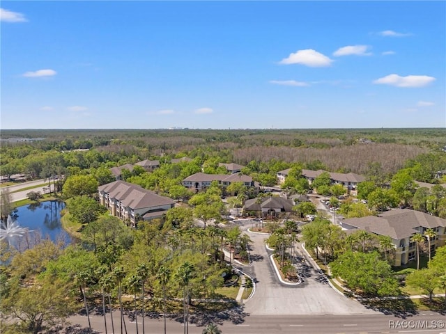 17108 Carrington Park Dr Unit 711, Tampa, FL 33647 - drone / aerial view featuring a forest view, a residential view, and a water view
