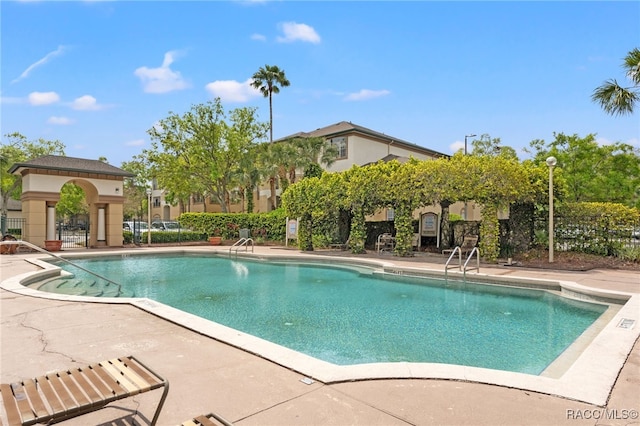 17108 Carrington Park Dr Unit 711, Tampa, FL 33647 - community pool with a patio area and fence