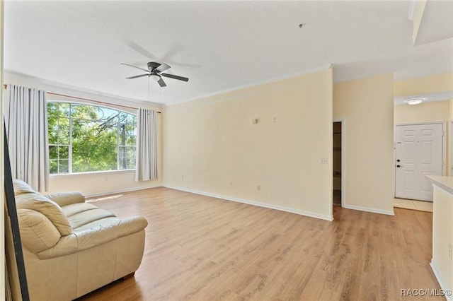 17108 Carrington Park Dr Unit 711, Tampa, FL 33647 - living area with light wood-style floors, ceiling fan, and baseboards