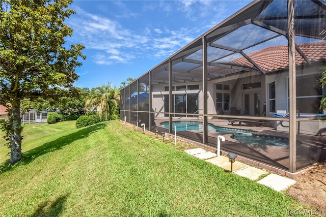 view of yard with glass enclosure