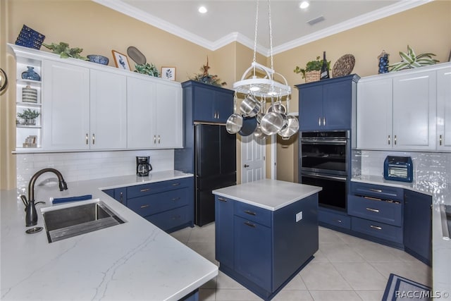 kitchen featuring double oven, a center island, white cabinets, and pendant lighting