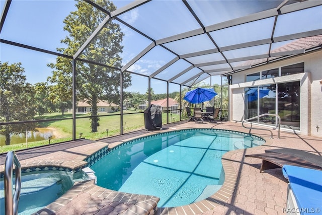 view of pool featuring a yard, a lanai, a patio area, an in ground hot tub, and a water view