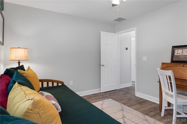 13618 SW 111th Cir, Dunnellon, FL 34432 - bedroom with wood finished floors, baseboards, and a ceiling fan