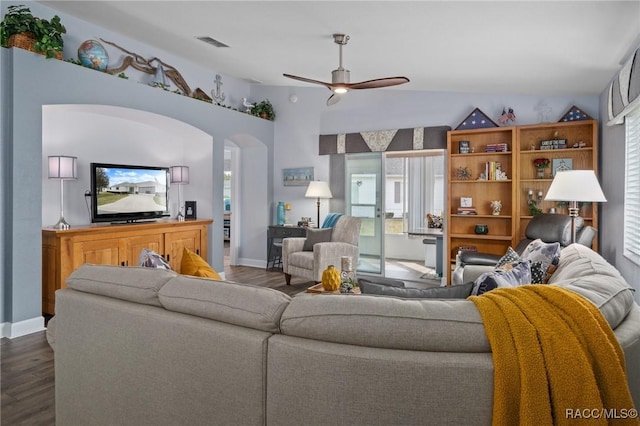 living area with visible vents, dark wood-style flooring, ceiling fan, and lofted ceiling