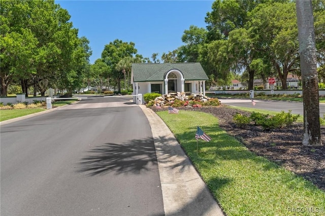 13618 SW 111th Cir, Dunnellon, FL 34432 - view of asphalt street with traffic signs and curbs