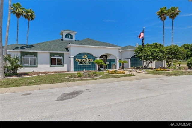 13618 SW 111th Cir, Dunnellon, FL 34432 - view of front of home with a garage, stucco siding, driveway, and a shingled roof