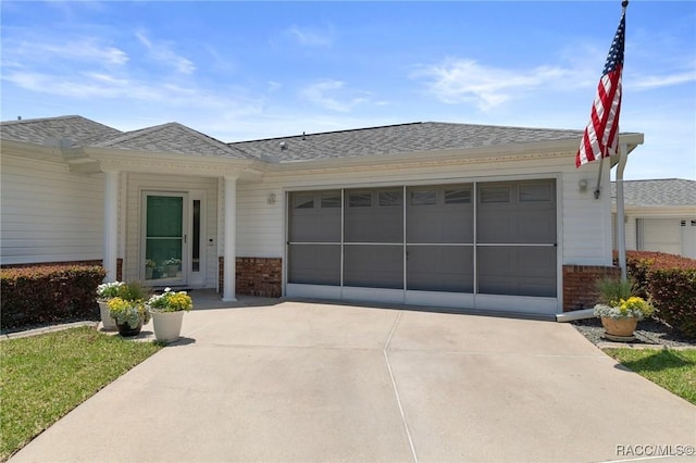 13618 SW 111th Cir, Dunnellon, FL 34432 - ranch-style home with concrete driveway, brick siding, a garage, and roof with shingles