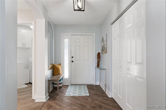 13618 SW 111th Cir, Dunnellon, FL 34432 - entryway featuring wood finished floors, baseboards, and arched walkways