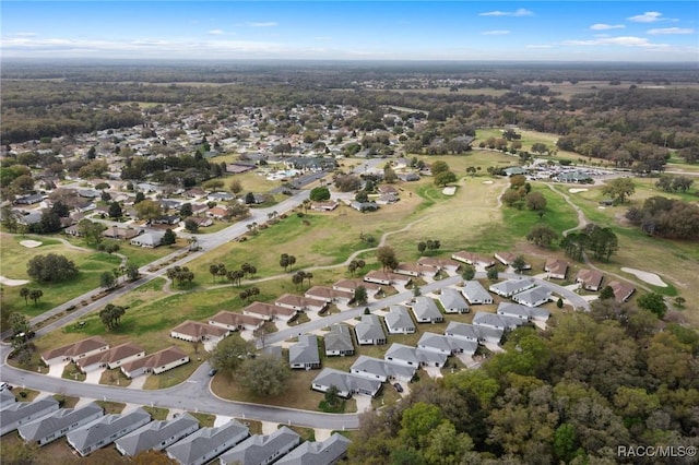 aerial view with a residential view and view of golf course