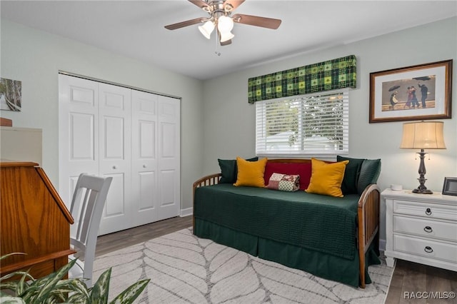 bedroom with a closet, ceiling fan, and wood finished floors