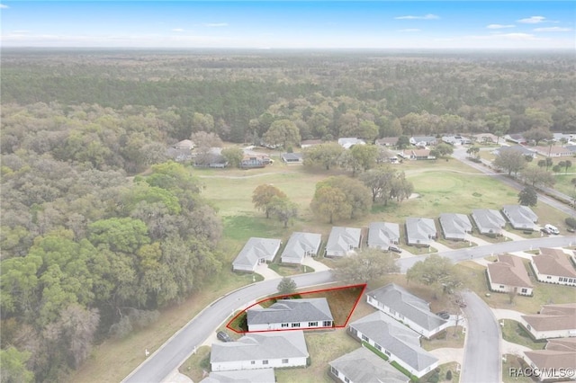 bird's eye view with a residential view and a view of trees
