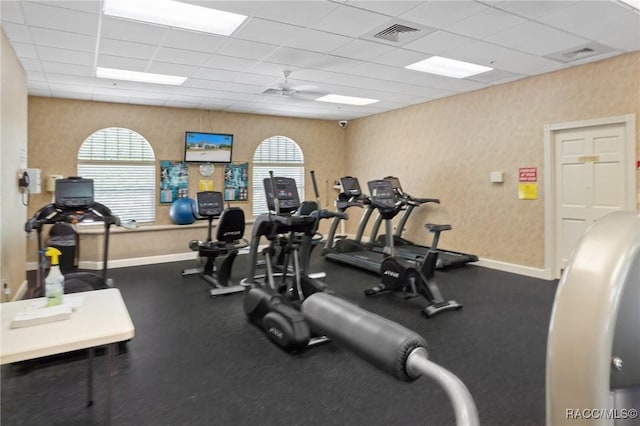 13618 SW 111th Cir, Dunnellon, FL 34432 - exercise room with a paneled ceiling, ceiling fan, baseboards, and wallpapered walls