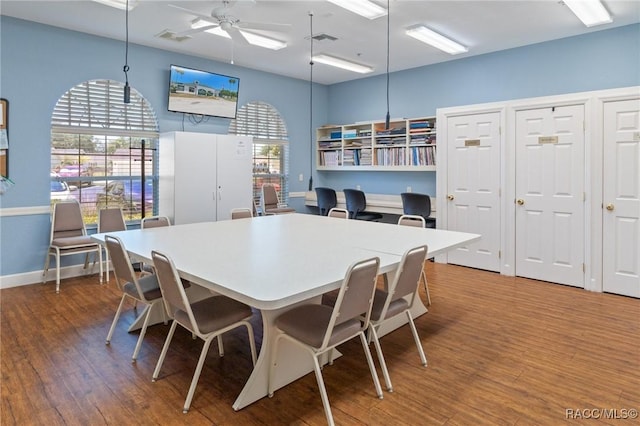 13618 SW 111th Cir, Dunnellon, FL 34432 - dining space with wood finished floors, a ceiling fan, and baseboards