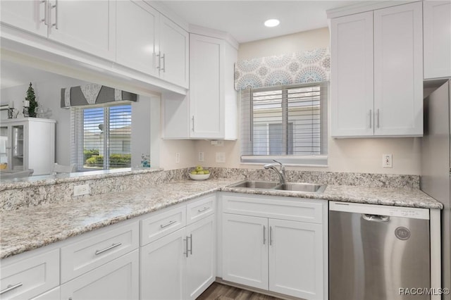 13618 SW 111th Cir, Dunnellon, FL 34432 - kitchen featuring dishwasher, a sink, white cabinetry, light stone counters, and recessed lighting