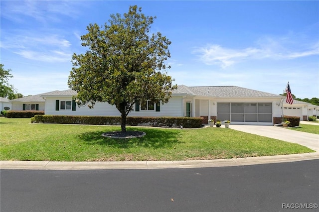 13618 SW 111th Cir, Dunnellon, FL 34432 - ranch-style house featuring a front lawn, driveway, and an attached garage