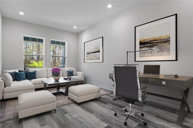 office space featuring recessed lighting, wood finished floors, and baseboards