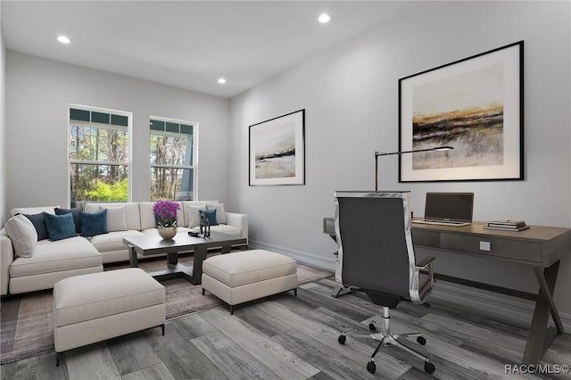 home office with baseboards, wood finished floors, and recessed lighting