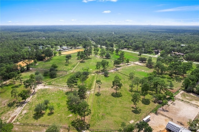 aerial view featuring a wooded view