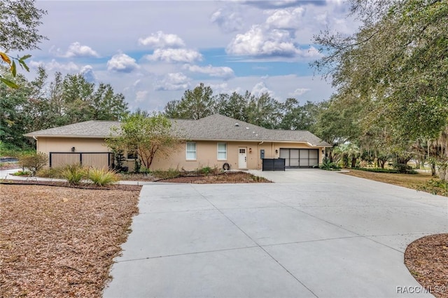 single story home featuring a garage