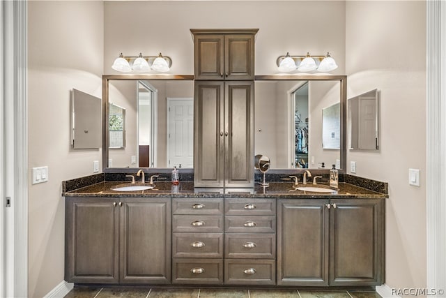 bathroom with tile patterned flooring and vanity