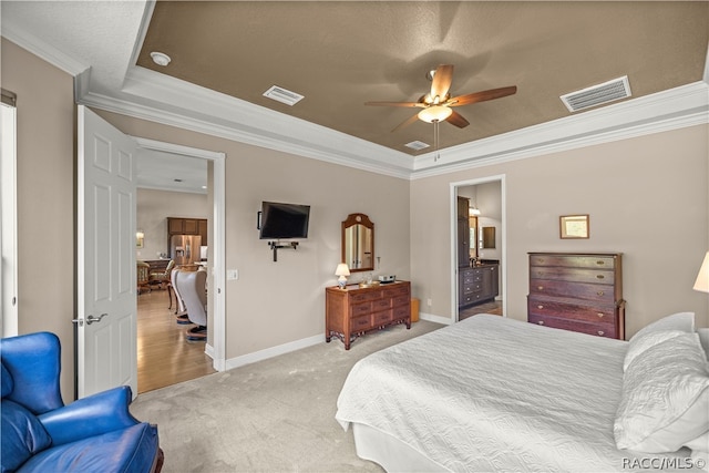 carpeted bedroom with a textured ceiling, connected bathroom, ceiling fan, and crown molding