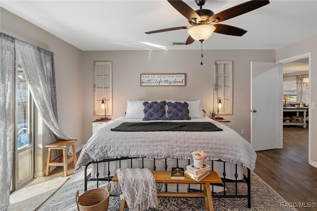 bedroom with ceiling fan and hardwood / wood-style floors