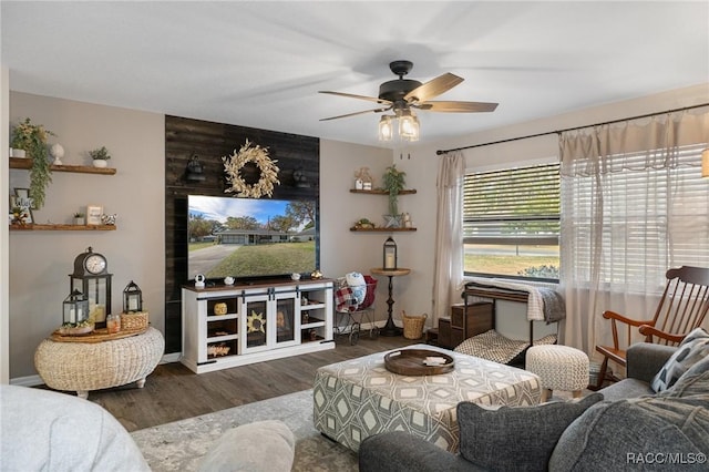 living room with ceiling fan and dark hardwood / wood-style flooring