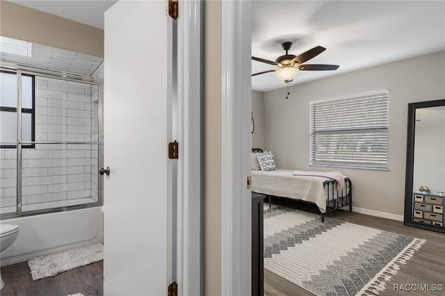 bedroom with dark wood-type flooring and ceiling fan