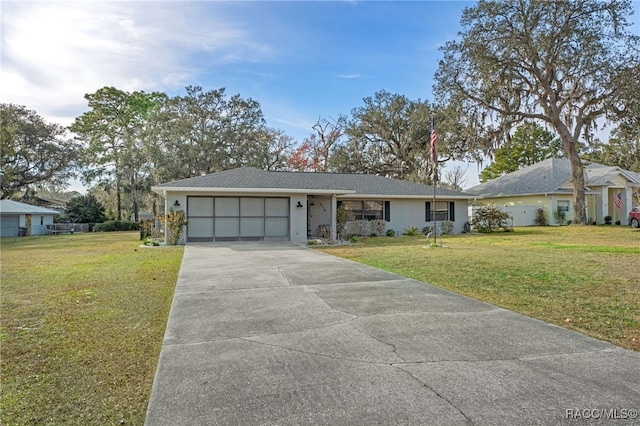 single story home with a garage and a front yard