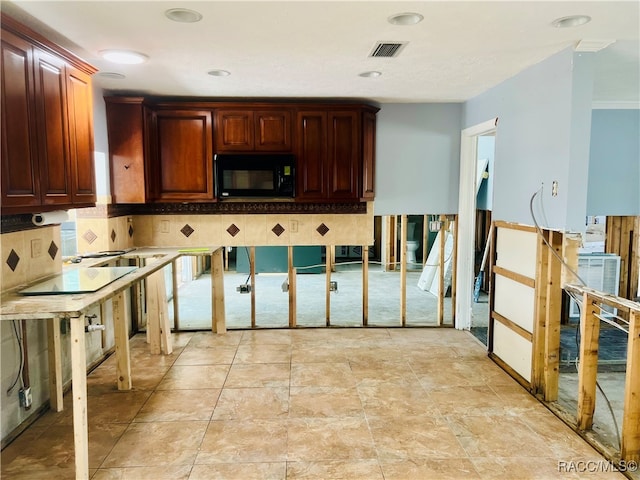 kitchen with ornamental molding and backsplash