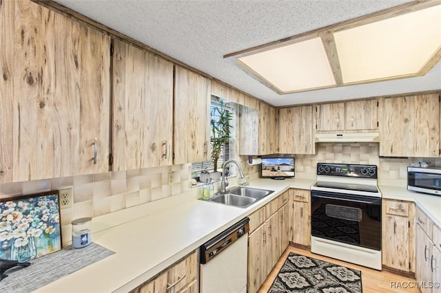 kitchen with light brown cabinets, electric stove, dishwasher, a textured ceiling, and sink