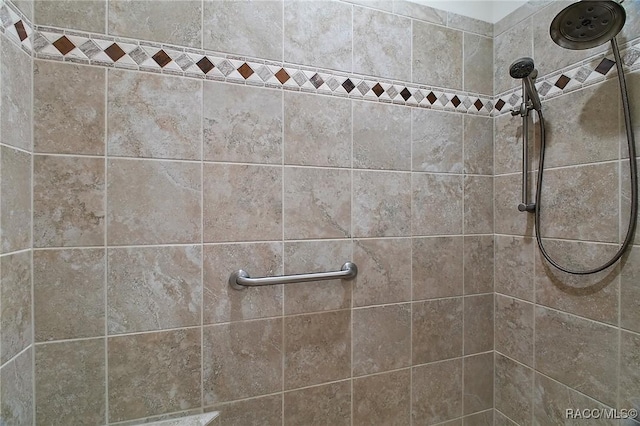 full bath featuring tiled shower