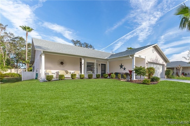 ranch-style house with a porch, a garage, and a front yard