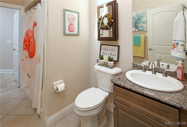 2101 N Brentwood Cir, Lecanto, FL 34461 - bathroom featuring toilet, vanity, tile patterned flooring, and baseboards