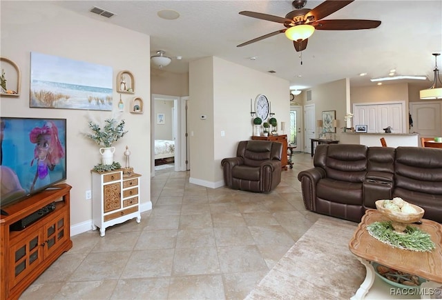 2101 N Brentwood Cir, Lecanto, FL 34461 - living area with a ceiling fan, light tile patterned flooring, and baseboards