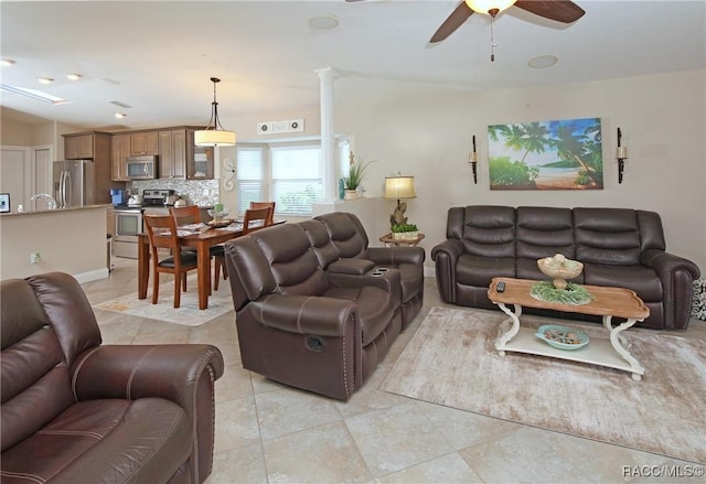 2101 N Brentwood Cir, Lecanto, FL 34461 - living area featuring a ceiling fan, light tile patterned floors, decorative columns, and baseboards