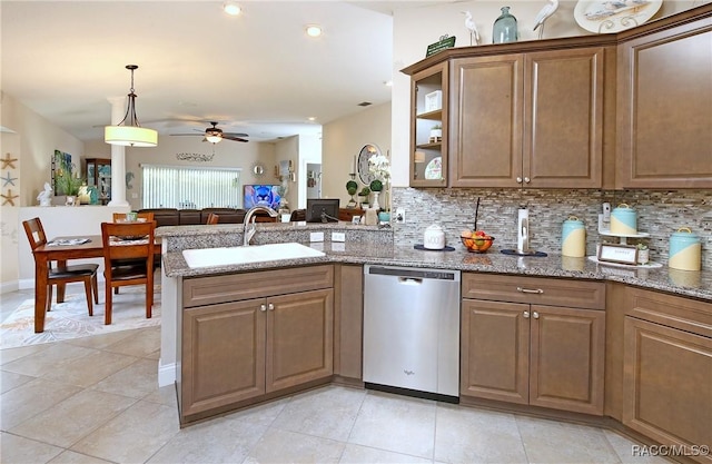 2101 N Brentwood Cir, Lecanto, FL 34461 - kitchen featuring stainless steel dishwasher, a sink, ceiling fan, a peninsula, and decorative backsplash