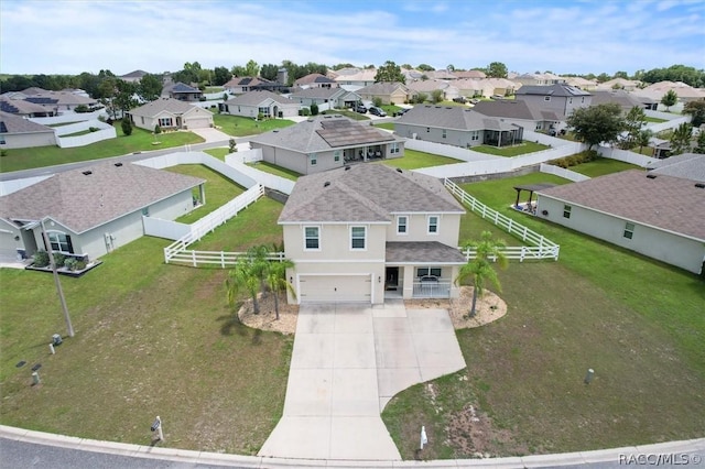 birds eye view of property with a residential view