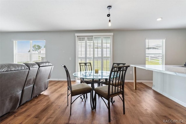 dining area featuring dark wood-style floors, recessed lighting, and baseboards