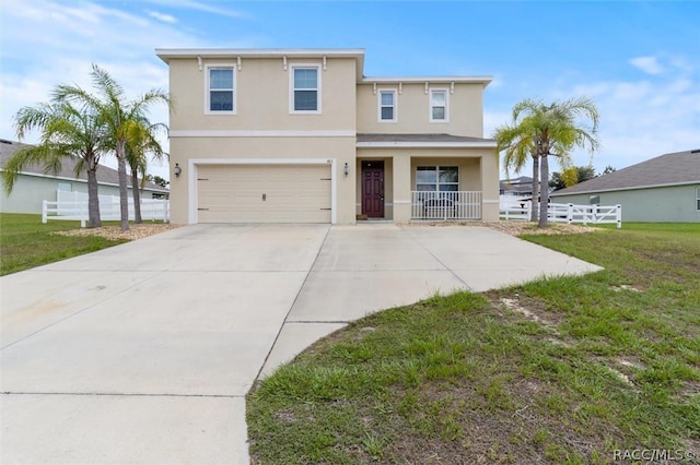 view of front of house featuring a porch, a garage, and a front lawn